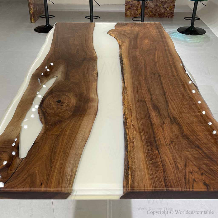 Luxury dining room featuring a walnut epoxy table set for family meals and gatherings.