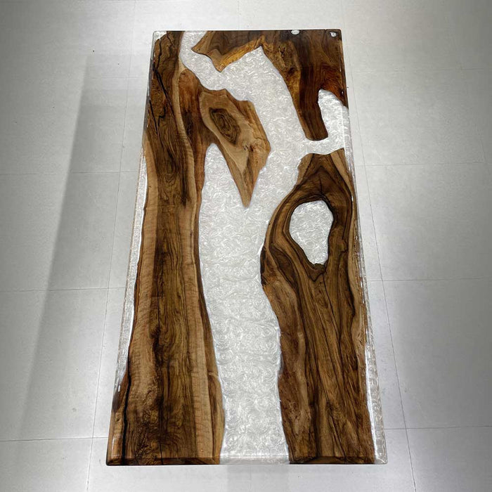 High-end black walnut table with elegant white swirl epoxy resin for Los Angeles dining spaces.