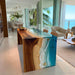 Luxury epoxy waterfall table in tropical inspired home interior