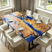 Luxury coastal dining table made from golden camphor wood with vivid epoxy wave design.