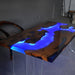 Wooden table with blue LED lights in a room setting