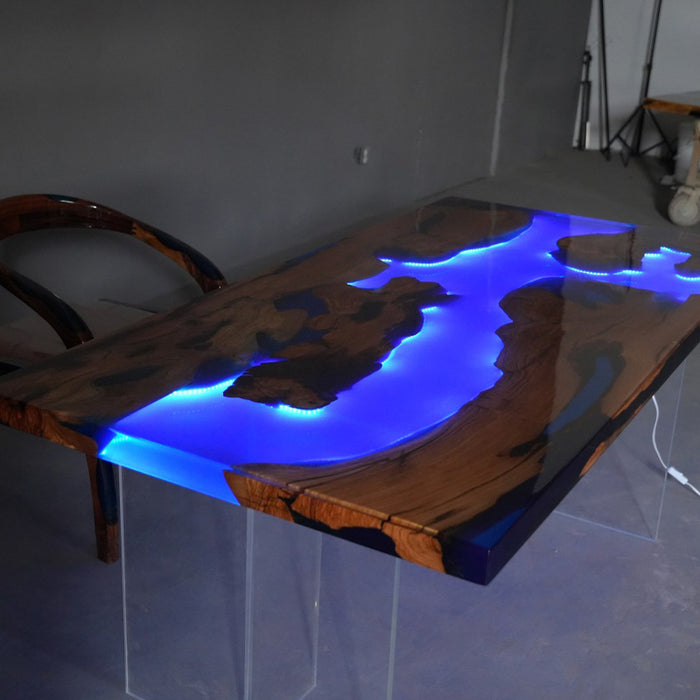 Wooden table with blue LED lights in a room setting