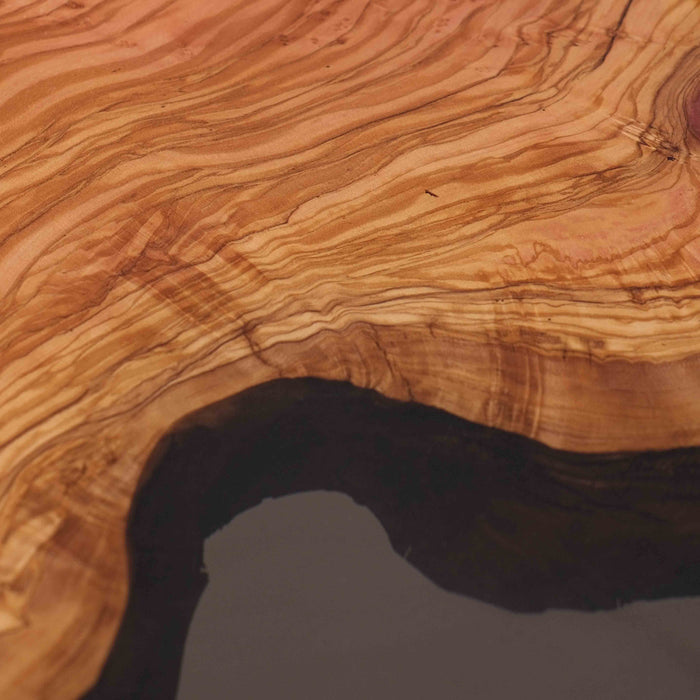 Luxury conference table made with olive wood slabs and translucent grey resin