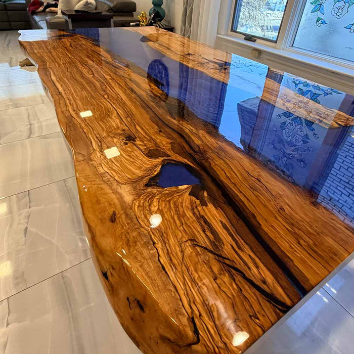 Luxury olive wood resin river dining table perfect for modern Los Angeles and Southern California homes.