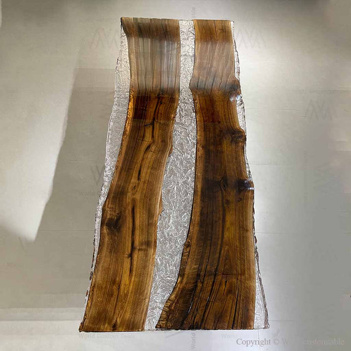 Custom luxury walnut river table used as a high-end office conference table near a window.