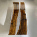 Custom luxury walnut river table used as a high-end office conference table near a window.