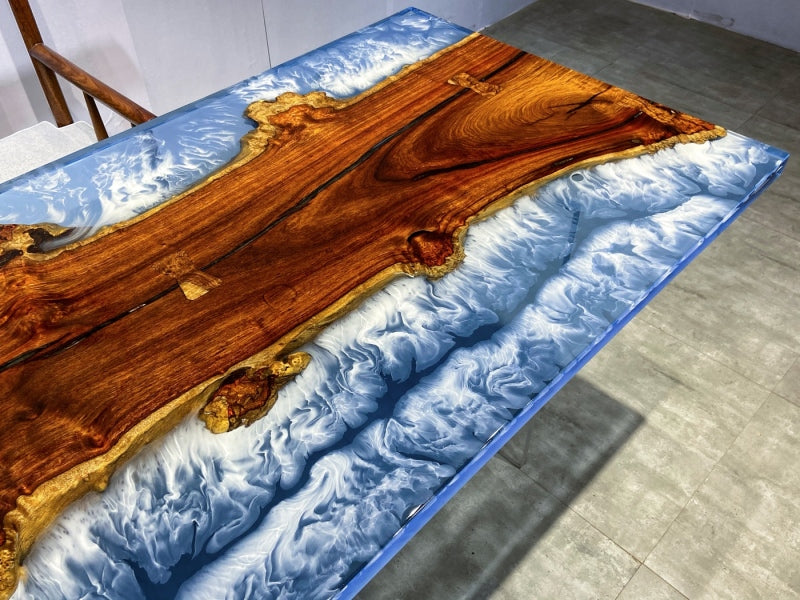 uxury conference table featuring golden camphor wood and artistic blue resin river design.