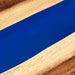 Close-up of a blue strip on a wooden surface