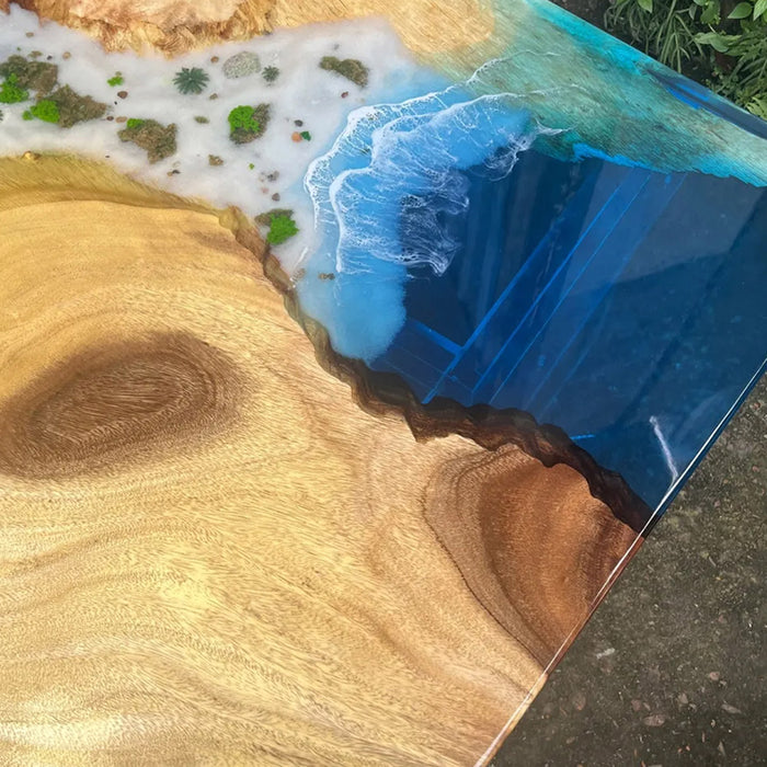 Large walnut epoxy river table styled in a luxury meeting room