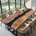 Luxury walnut dining table with resin detailing and sleek modern styling.