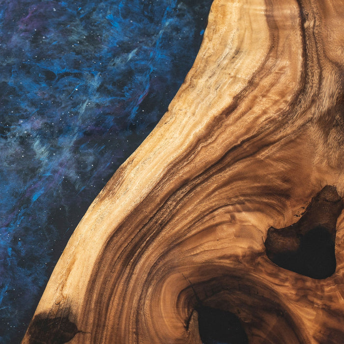 Luxury walnut dining table showcasing starry sky epoxy resin and natural wood grain.