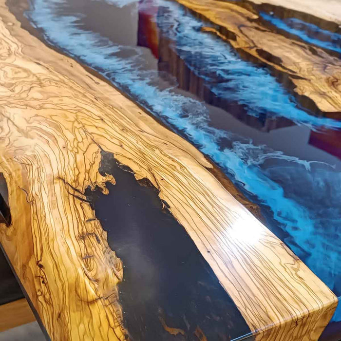 Luxury wood and resin dining table handcrafted with premium olive wood