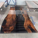 Luxury wood epoxy meeting table featuring natural walnut grain and elegant black resin details