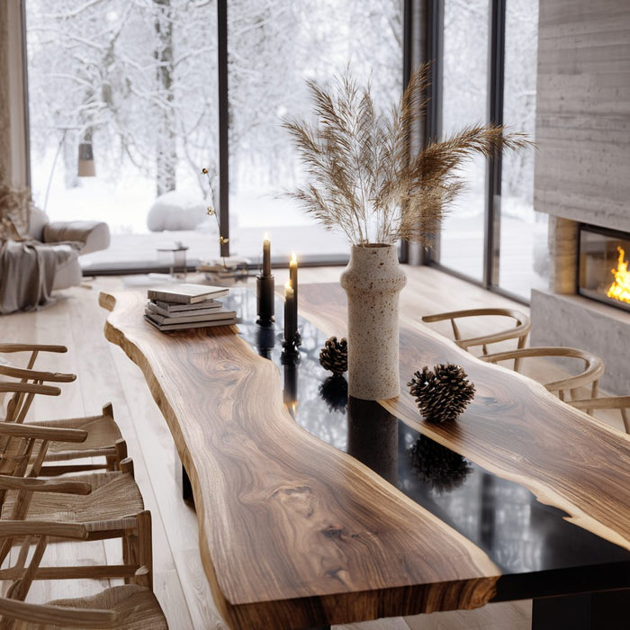 Modern living room with a long wooden dining table and chairs, large windows showing a snowy landscape.