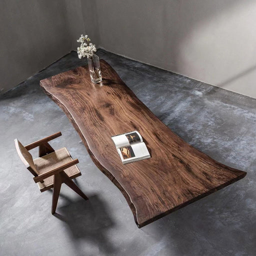 LuxWood handcrafted live edge solid wood table in a minimalist concrete room