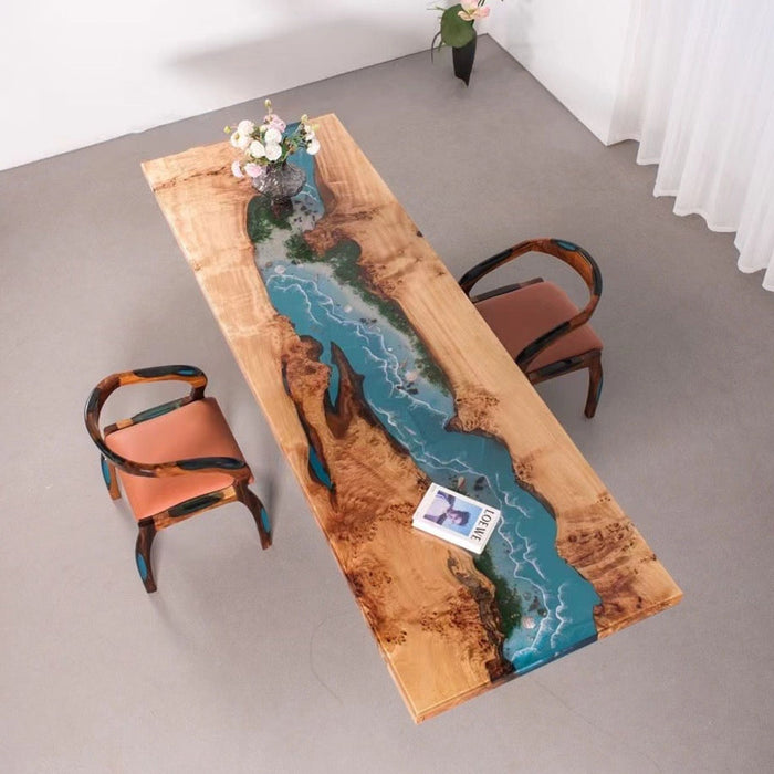 Handcrafted epoxy resin river table with natural wood grain and blue water effect