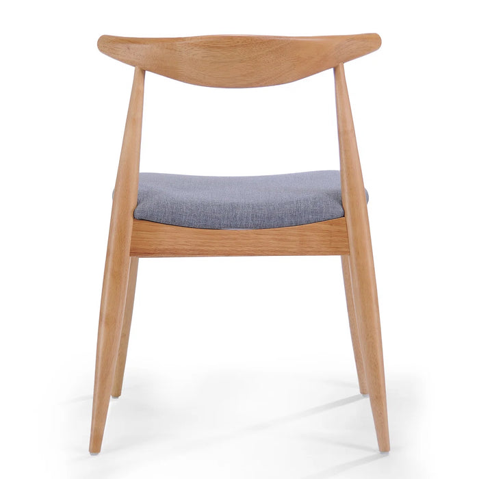 Wooden chair with a blue cushion on a white background
