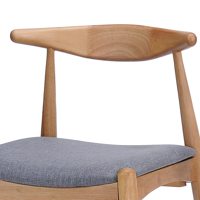 Wooden chair with a gray cushion on a white background