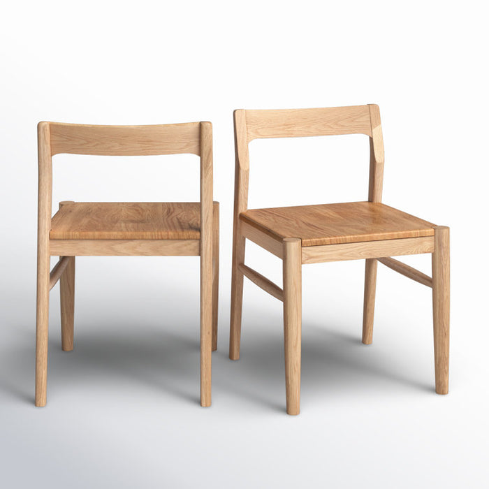 Two wooden chairs on a white background
