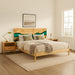 Bedroom with wooden bed, nightstands, and a lamp.