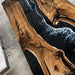 Modern black walnut conference table with custom black resin river, perfect for luxury offices and commercial interiors.