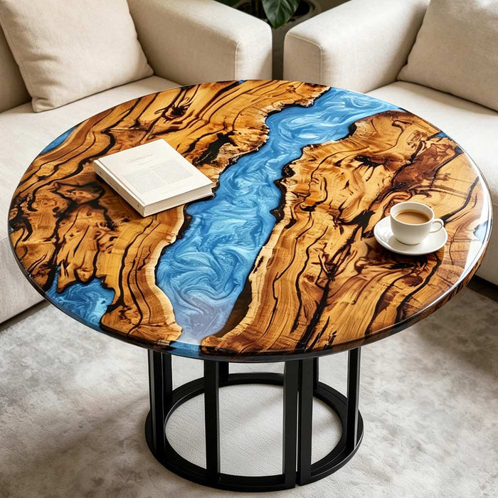 Modern living room featuring a round olive wood coffee table with blue epoxy resin river design