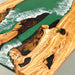 Top view showcasing the semi-transparent blue epoxy resin surface and olive wood patterns.