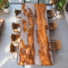 Modern olive wood table with clear epoxy ice effect in contemporary space
