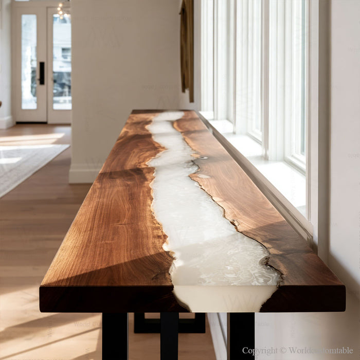 Black walnut epoxy console table styled in a modern hallway