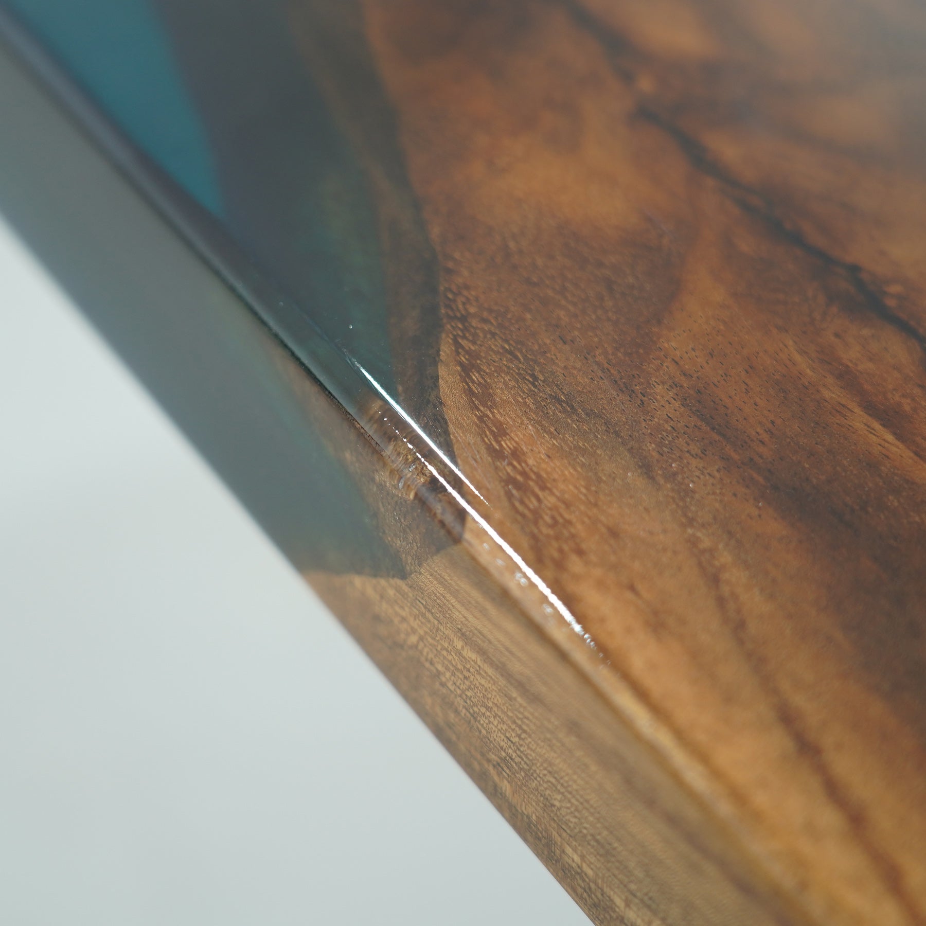 Modern boardroom table with epoxy and wood finish.