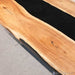 Modern epoxy dining table black walnut in luxury apartment dining area