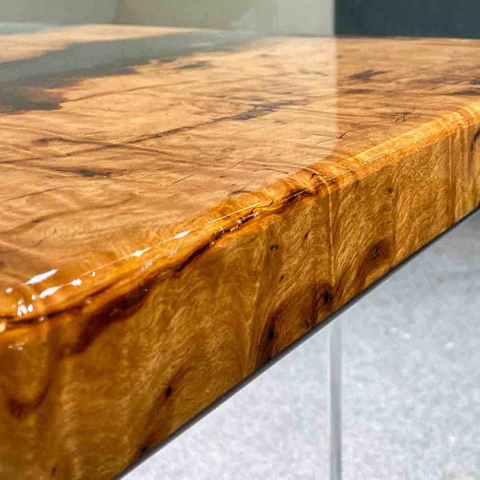 Wooden surface with a glossy finish on a neutral background