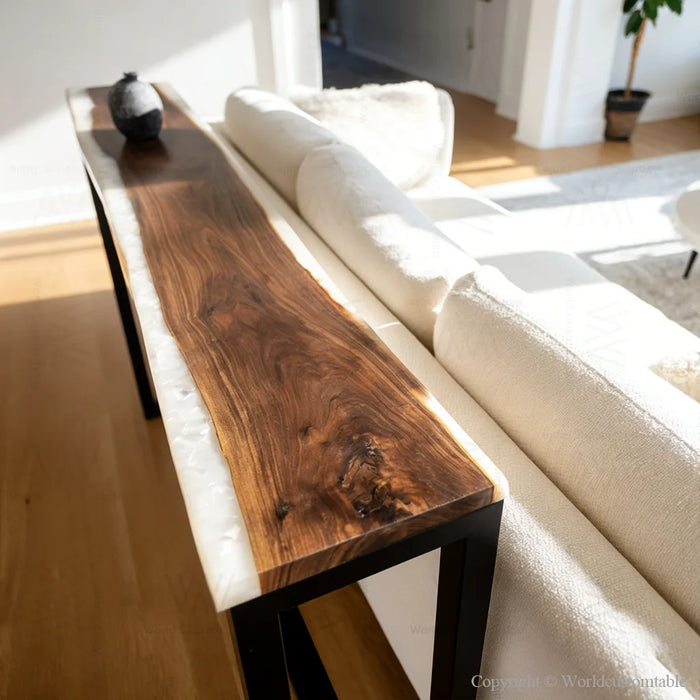 Modern epoxy resin side table placed over a sofa in a living room setting