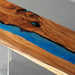 Modern walnut kitchen countertop enhanced with mysterious blue epoxy resin