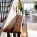 Modern epoxy river console table in entryway with elegant lighting