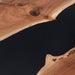 Close-up of a wooden surface with natural grain and texture on a black background