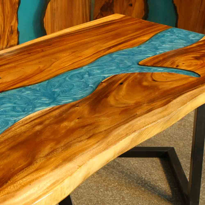 Wooden table with a blue resin river design