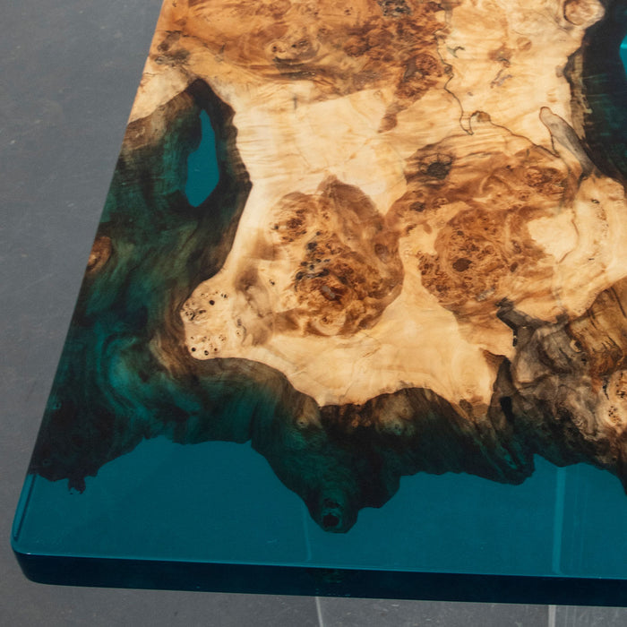 Modern epoxy and wood conference table in glass-walled office