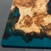 Modern epoxy and wood conference table in glass-walled office
