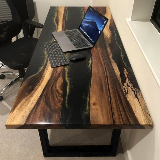 Modern executive office desk made of solid walnut wood and black epoxy.