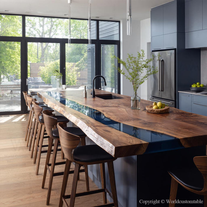 Modern farmhouse dining table handcrafted from walnut wood with coastal navy epoxy finish