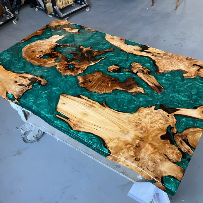Green swirl epoxy dining table with unique natural burl wood grain