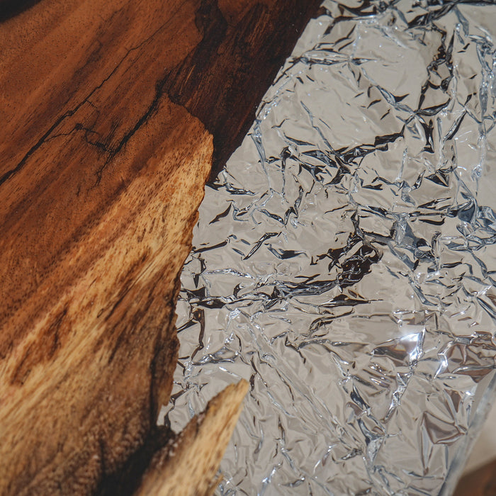 A side view of the Ice Crystal Epoxy Table highlight the ice-crystal-like pattern of the transparent epoxy surface.