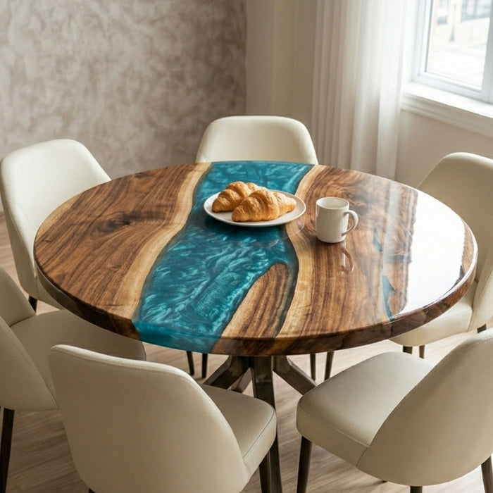 High-end resin and wood coffee table styled with croissants and coffee in a bright, minimalist interior.