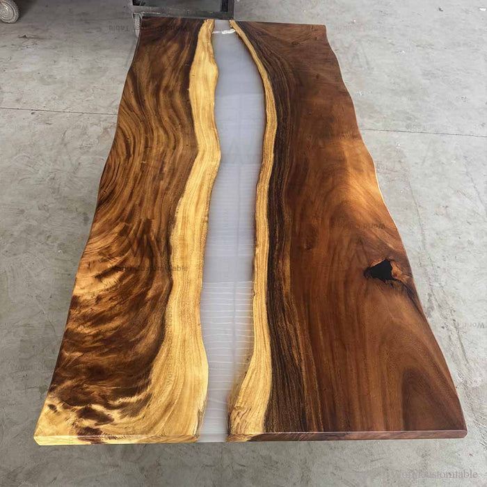 Wooden table with a natural grain pattern on a concrete floor.