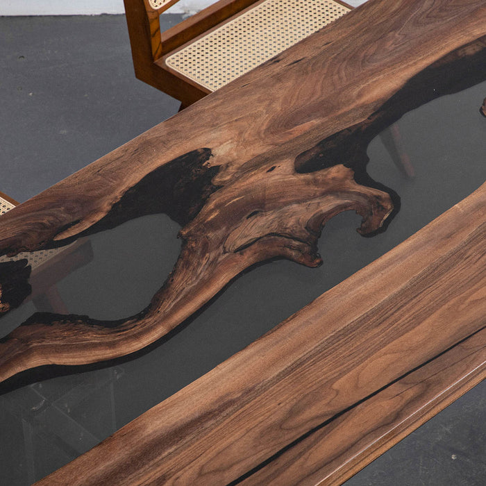 Modern olive wood dining table with deep black resin inlay