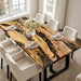 Modern olive wood dining table enhanced with dark resin details and clean design.