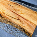 Top-down view highlighting the transparent epoxy resin surface and golden wood