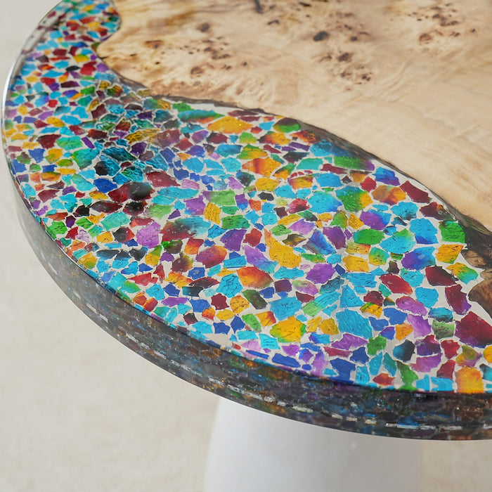 Modern resin river dining table featuring beach sand and clear epoxy