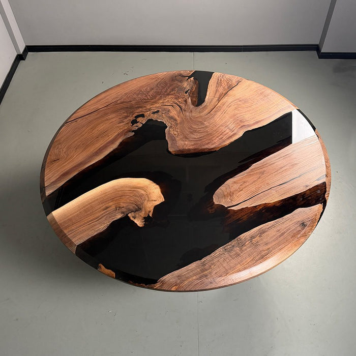 modern round dining table with black epoxy resin